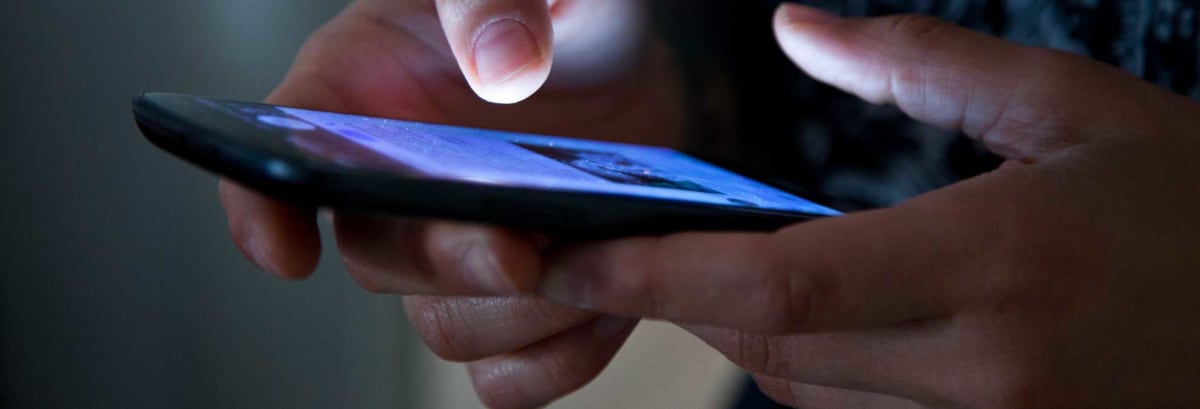 typing on a cell phone screen