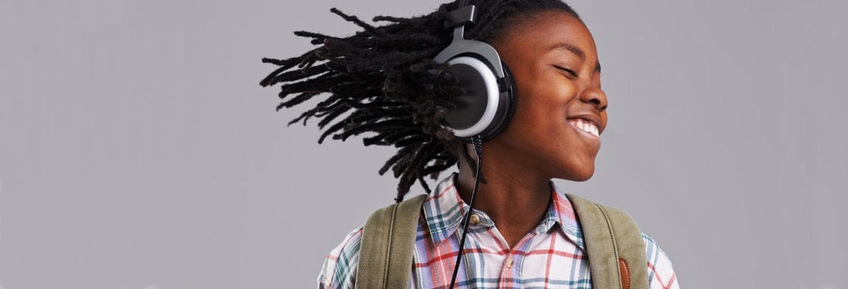 Young girl bobbing her head to the beat of the music.