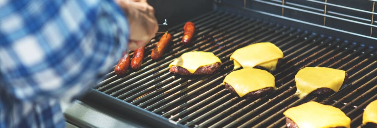 Weber grill BBQ burgers and hot dogs