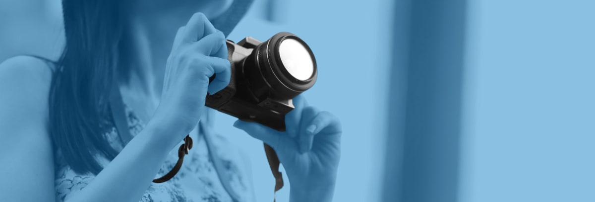 woman using camera on vacation