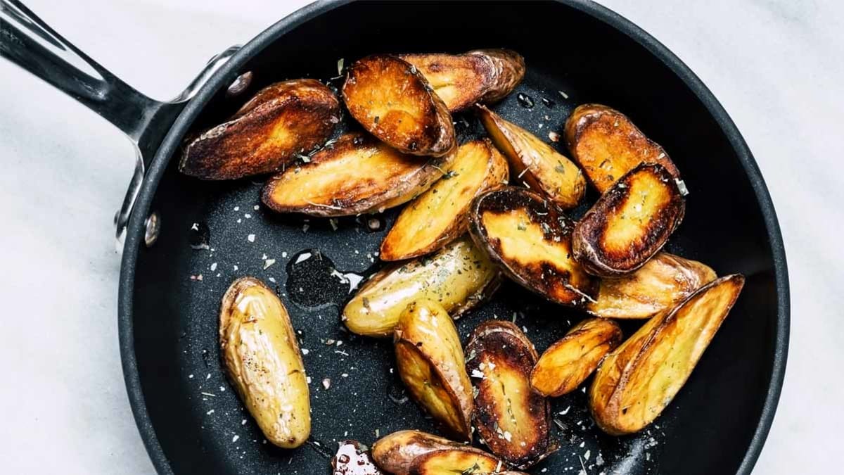 frying pan cooking potatoes