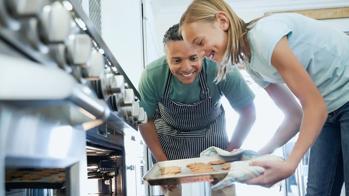 Father and daughter baking