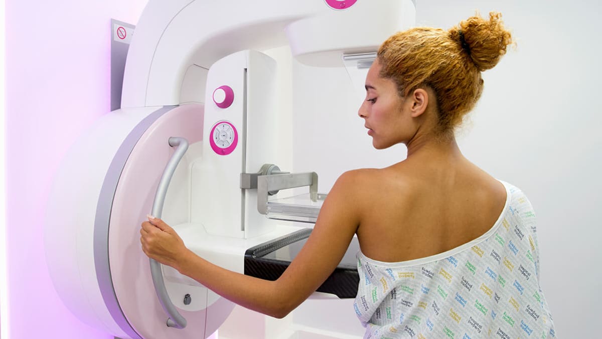 Person getting a mammogram.