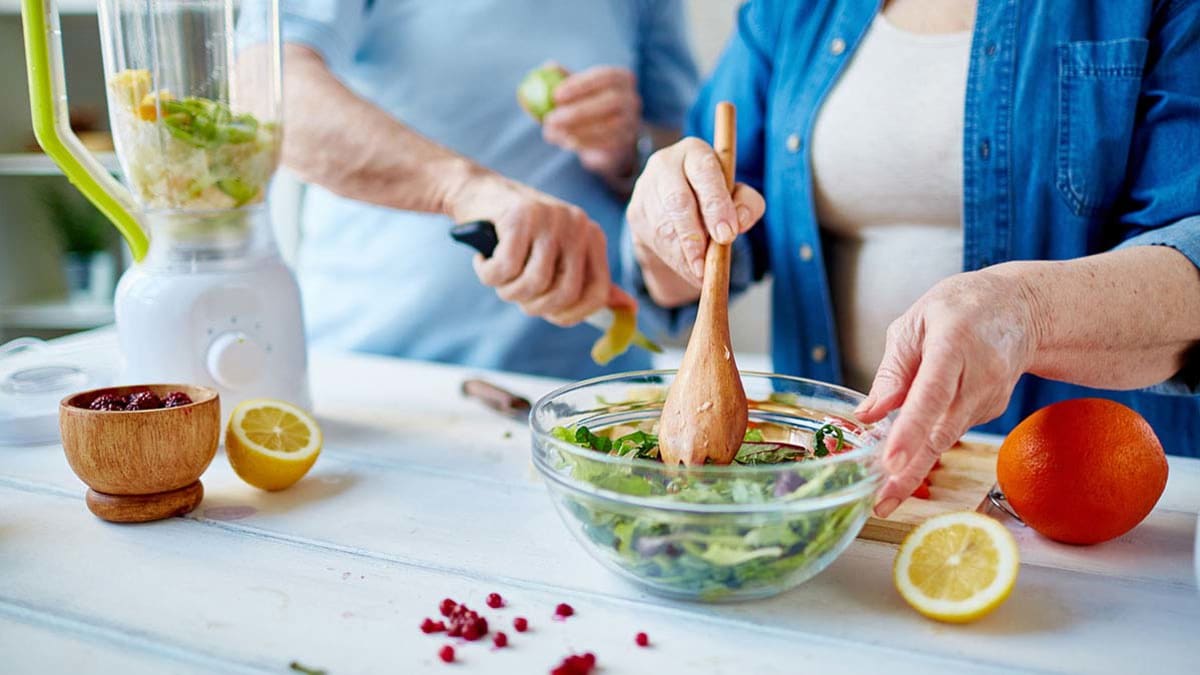 making salad in kitchen