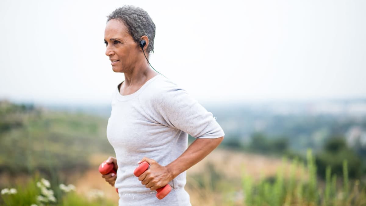 senior woman using light weights