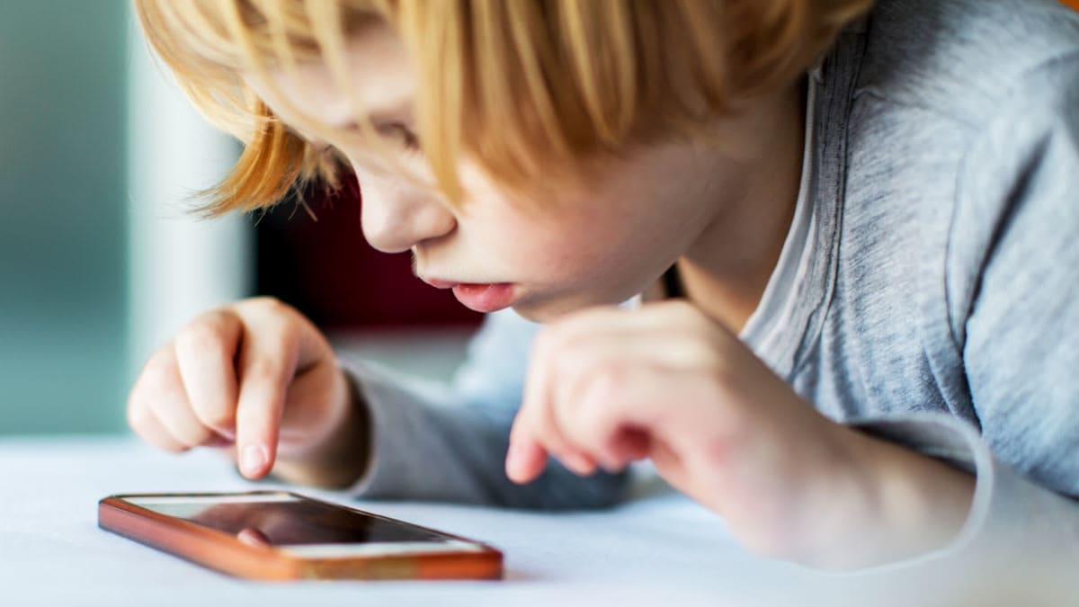 child playing game on smartphone