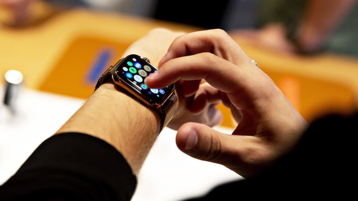 A customer uses an Apple Inc. Watch Series 4 smartwatch during a sales launch at a store in Chicago, Illinois, U.S., on Friday, Sept. 21, 2018. The iPhone XS is up to $200 more expensive than last years already pricey iPhone X and represents one of the smallest advances in the product lines history. But that means little to the Apple Inc. faithful or those seeking to upgrade their older iPhone. Photographer: Daniel Acker/Bloomberg via Getty Images
