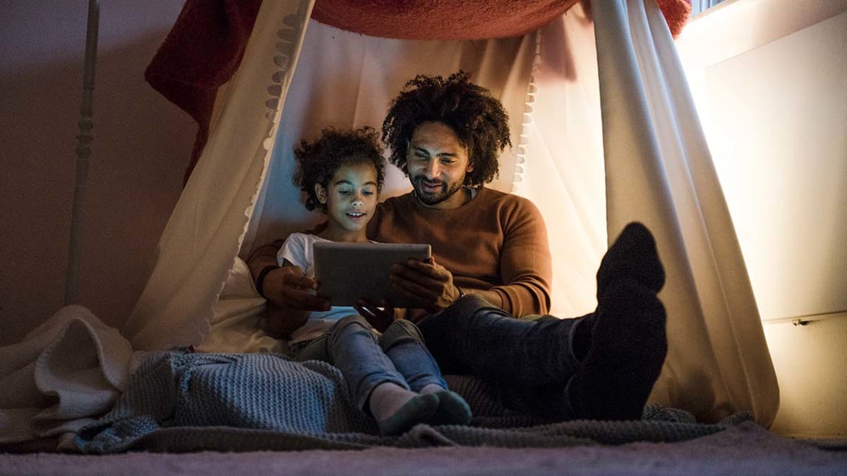 Father and child and tablet