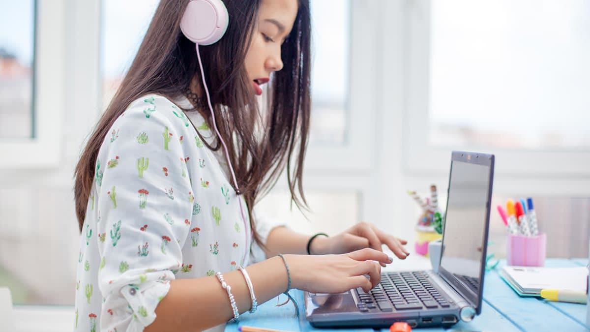 teenager using laptop