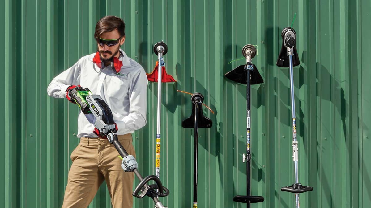 technician examining string trimmers