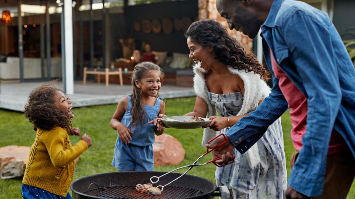 family having backyard bbq
