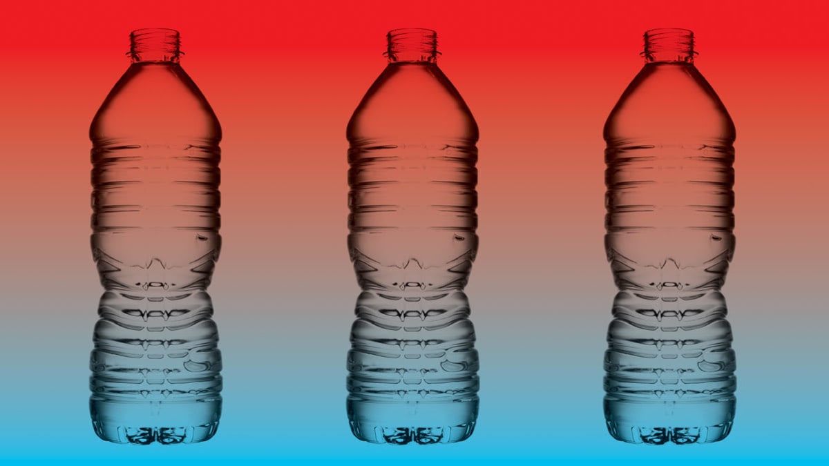 three plastic water bottles on blue and red background