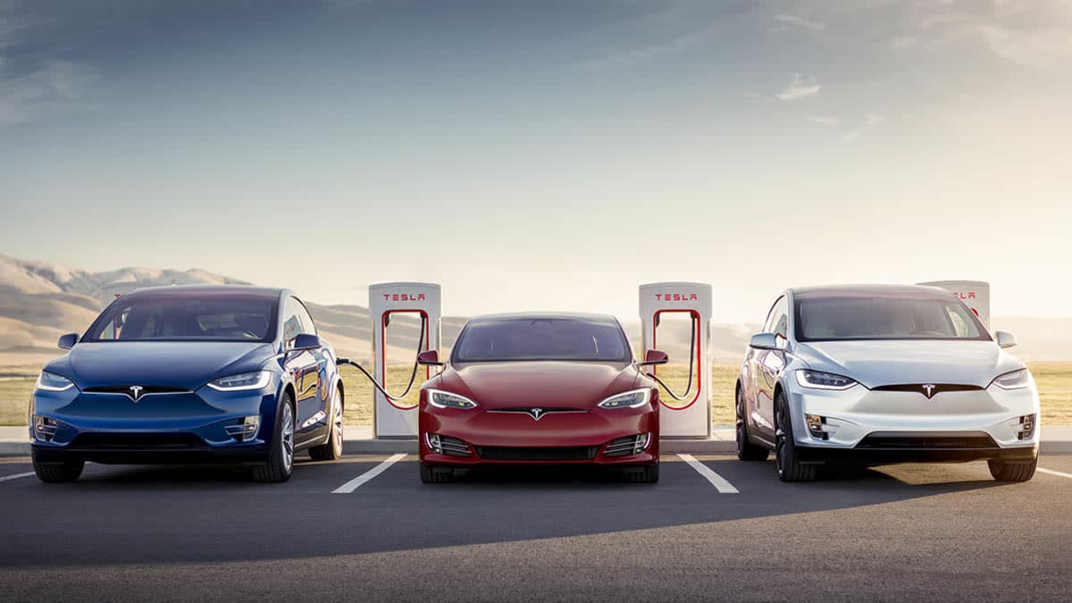 Three Teslas charging