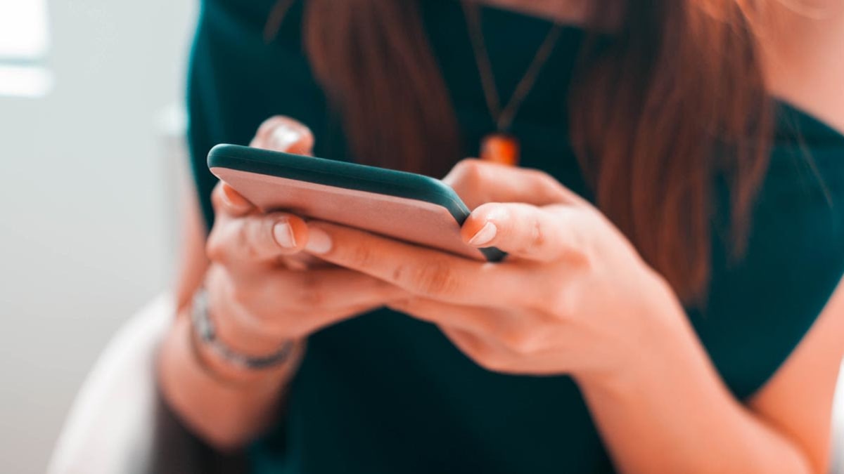 hands holding smartphone