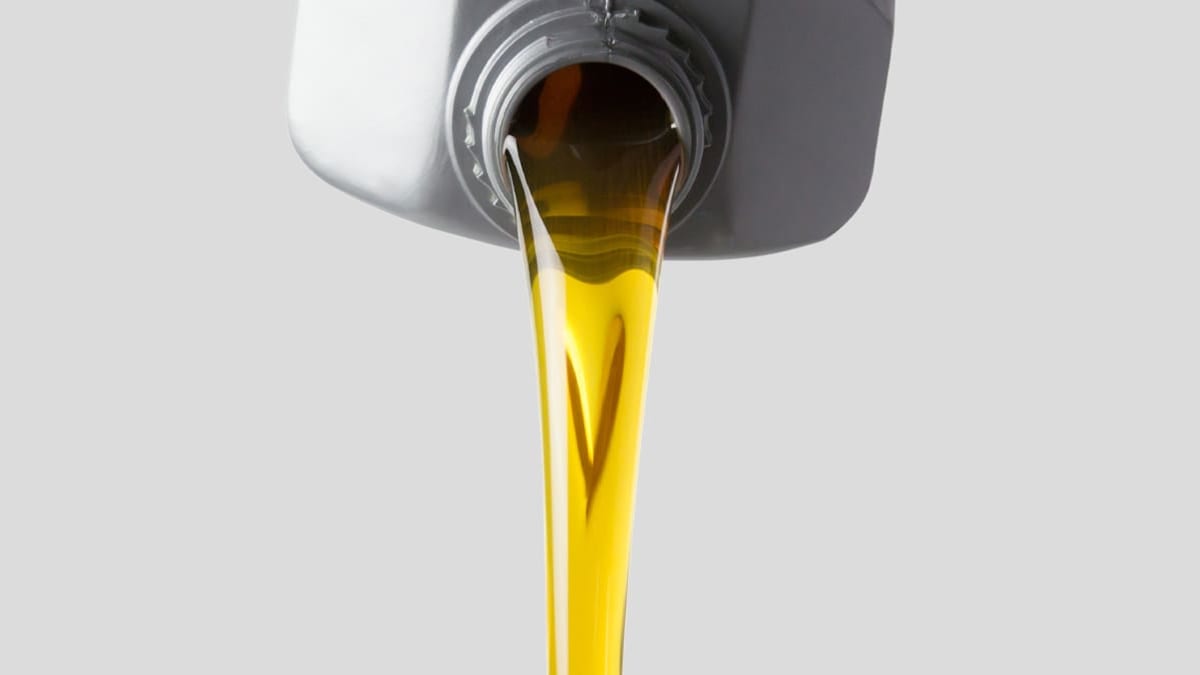 car oil pouring from container
