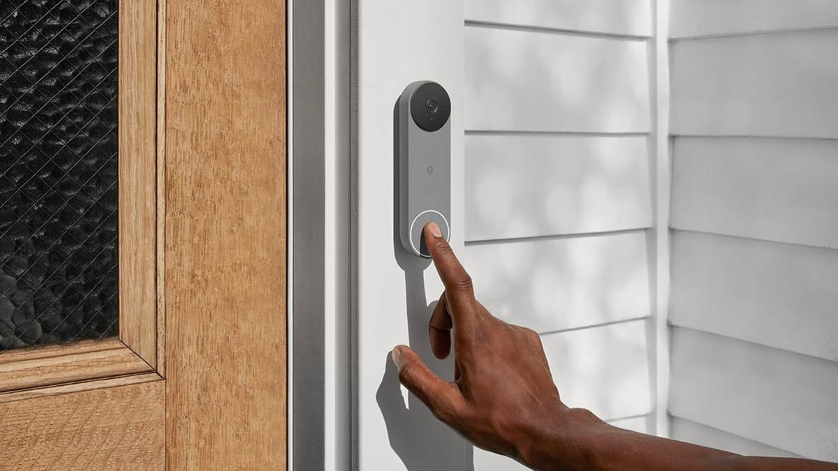 Person ringing a Nest security camera doorbell