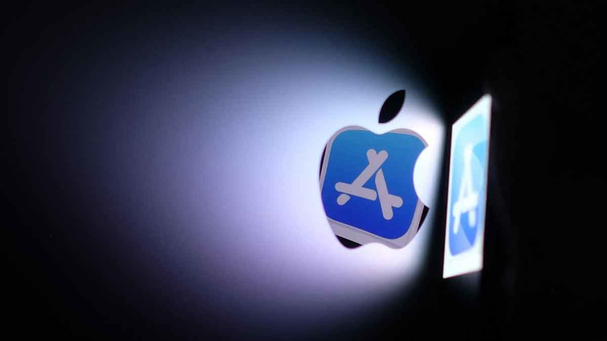 phone casting reflection and shadow of Apple and App Store logos