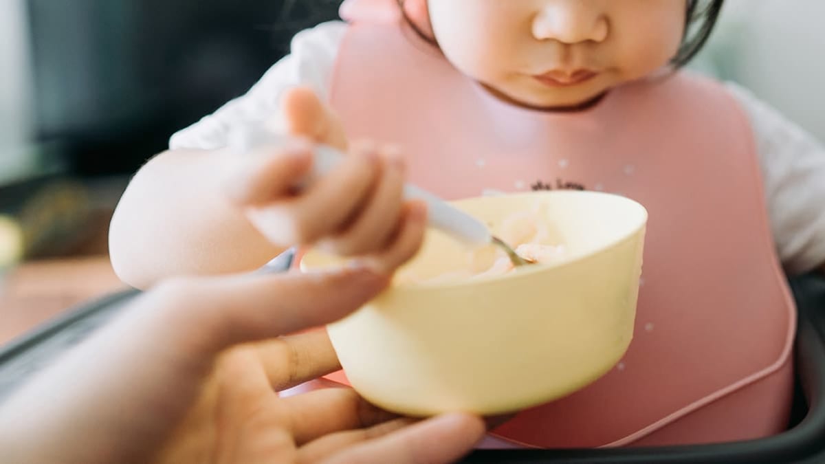 Baby eating rice cereal