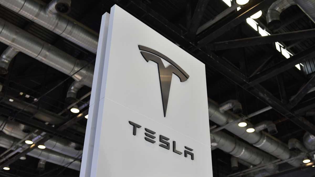 Tesla sign with logo inside building