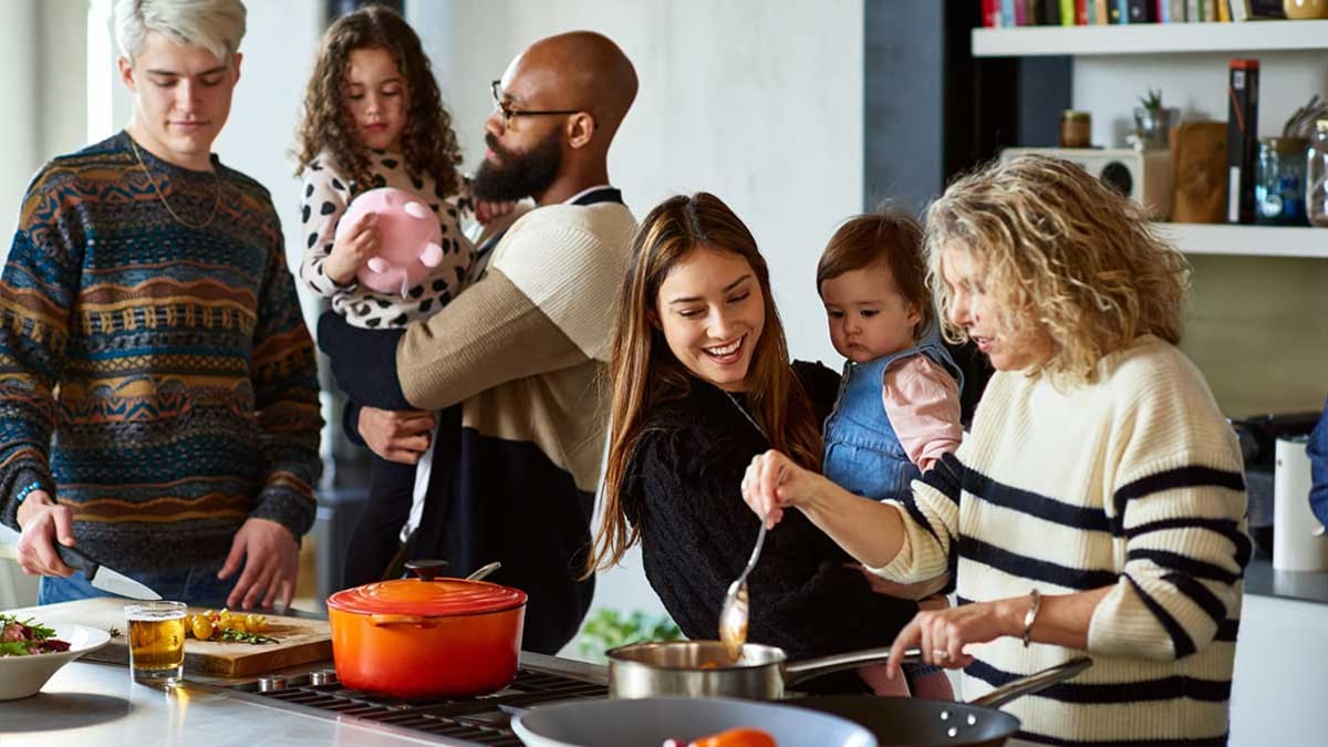 Extended family cooking together in the kitchen