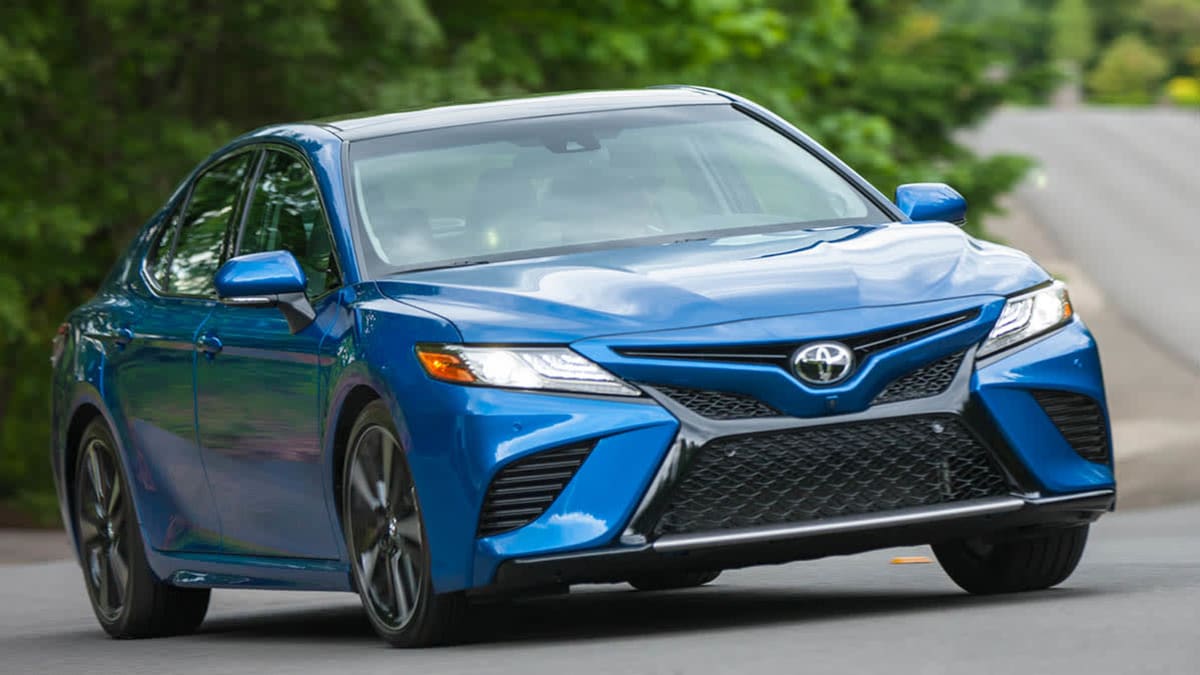 Blue 2019 Toyota Camry driving