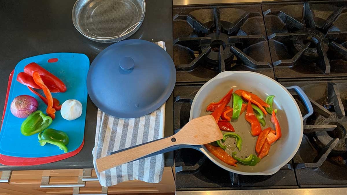 Always Pan cooking peppers on a stove