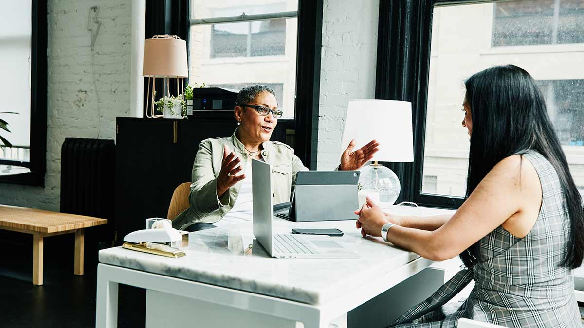 A person speaking to a financial advisor
