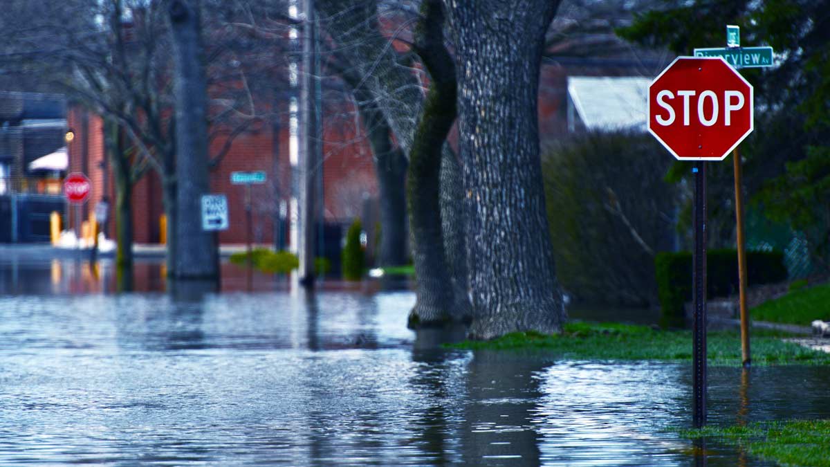 Flooded residential street at a stop sign