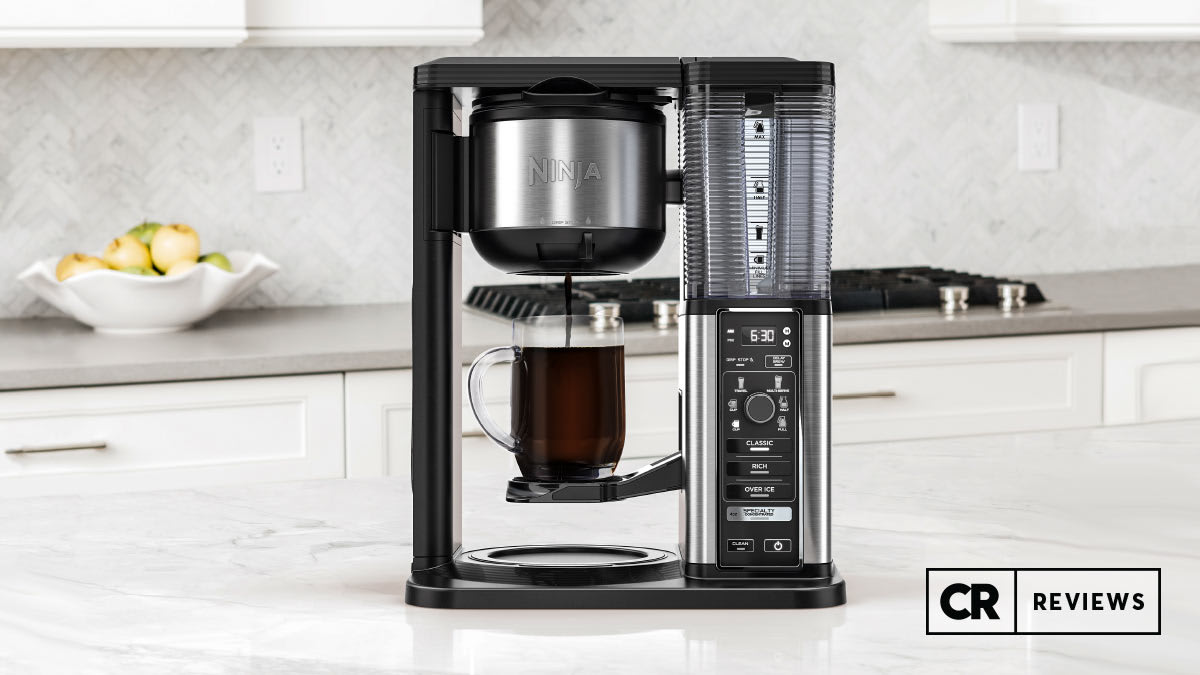 Ninja CM407 Specialty Coffee Maker on marble kitchen counter with cabinets in background