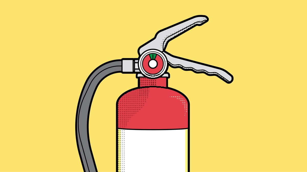 Fire extinguisher on yellow background