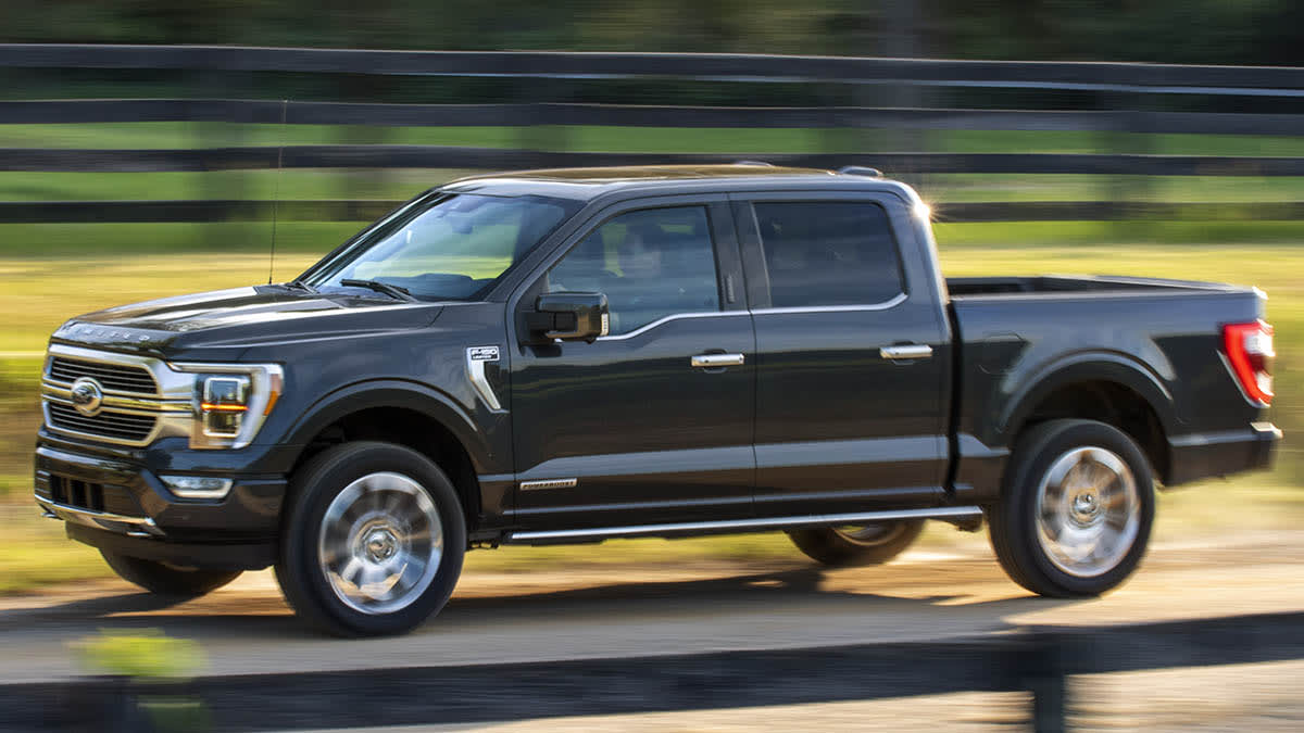 2021 Ford F-150 driving past a fence
