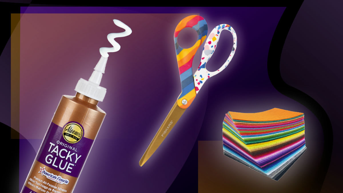 craft glue, scissors, and felt squares on a black and purple background