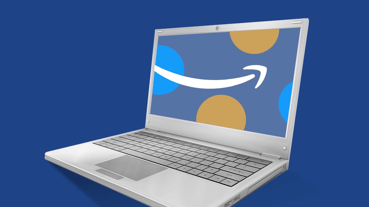 A laptop open with the Amazon arrow on its screen.