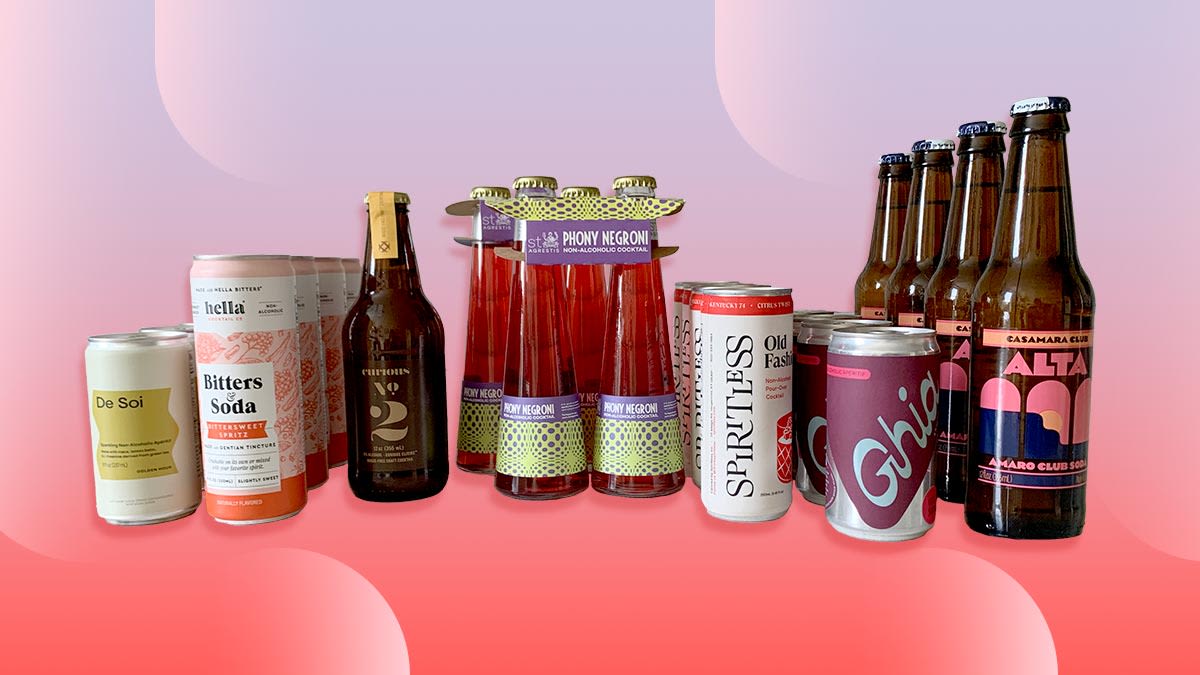 bottles and cans on pink and purple background