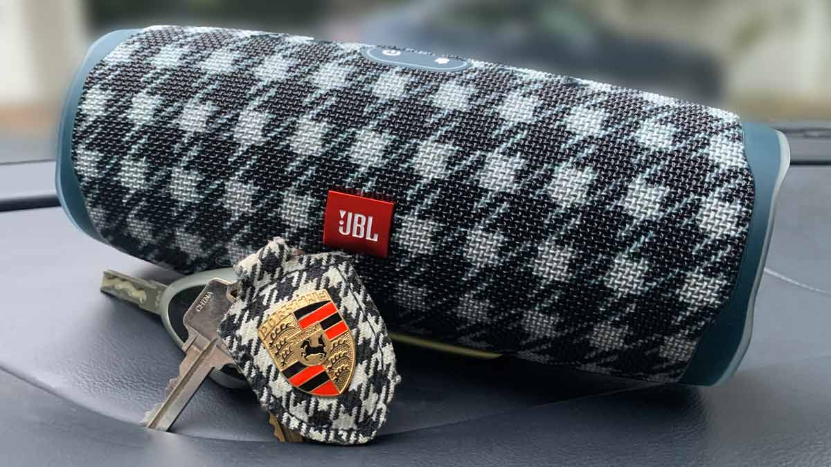 JBL speaker with personalized Porsche pattern with Porsche keychain in front of it