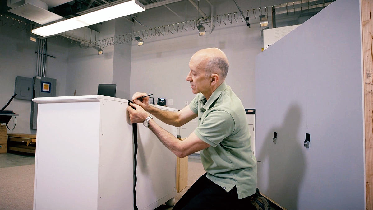 CR technician anchoring a dresser.