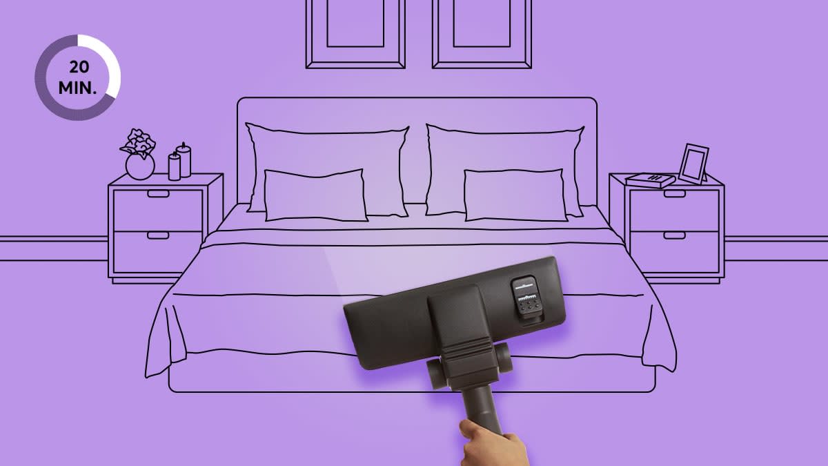 Hand vacuuming mattress in bedroom setting with purple background
