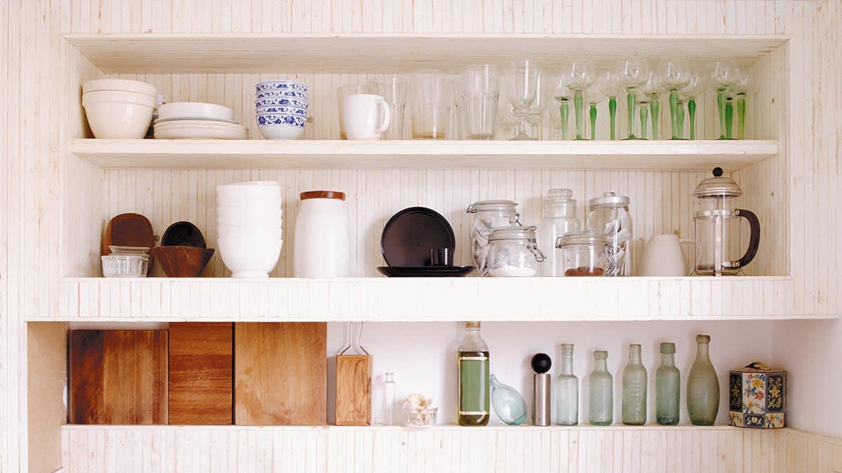 organized tableware on kitchen shelves