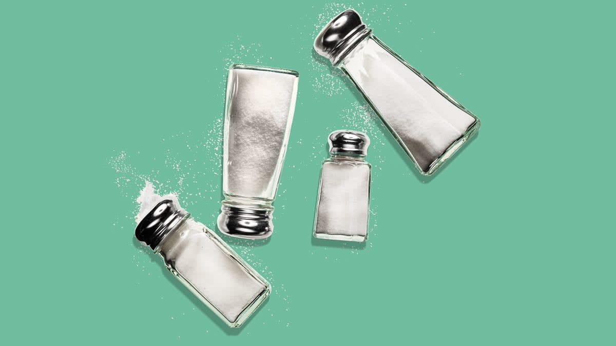 overhead view of four spilled salt shakers