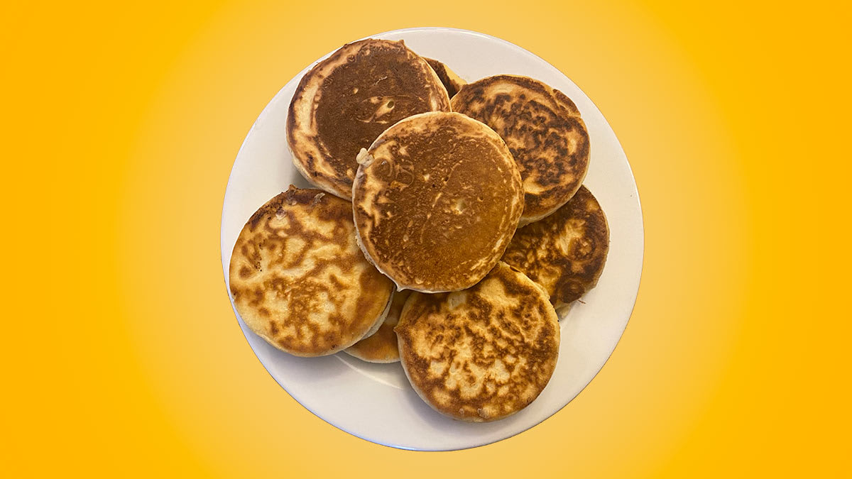 plate of pancakes on a yellow background
