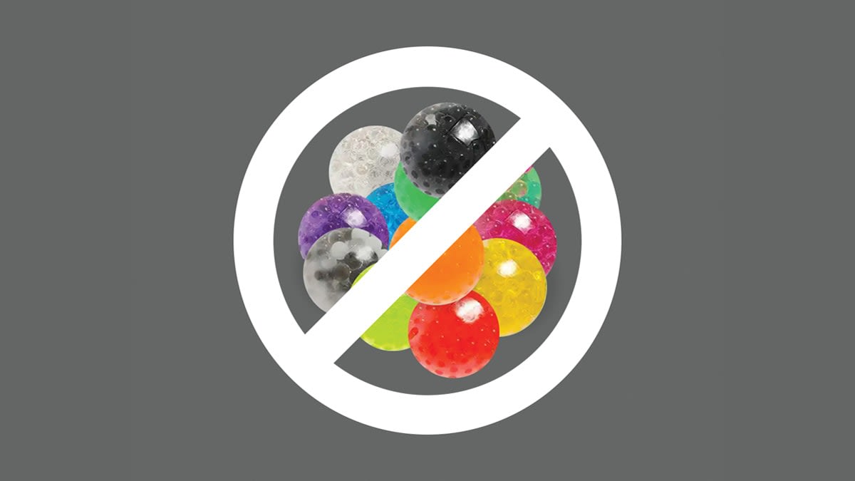 illustration of various colored water beads with white 'no' symbol over them