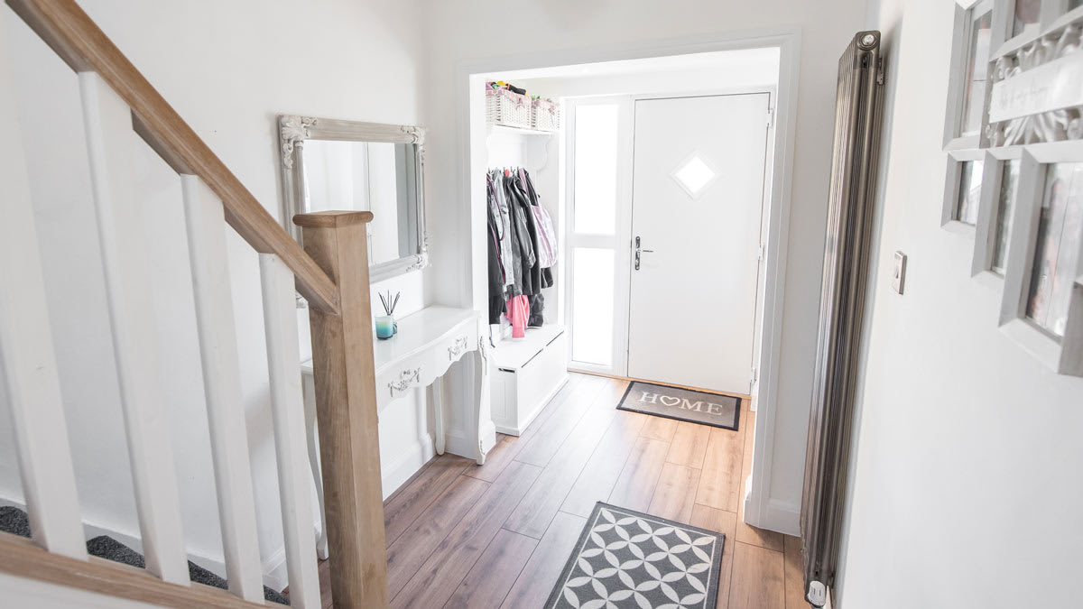 An entryway to a house where jackets and shoes are kept