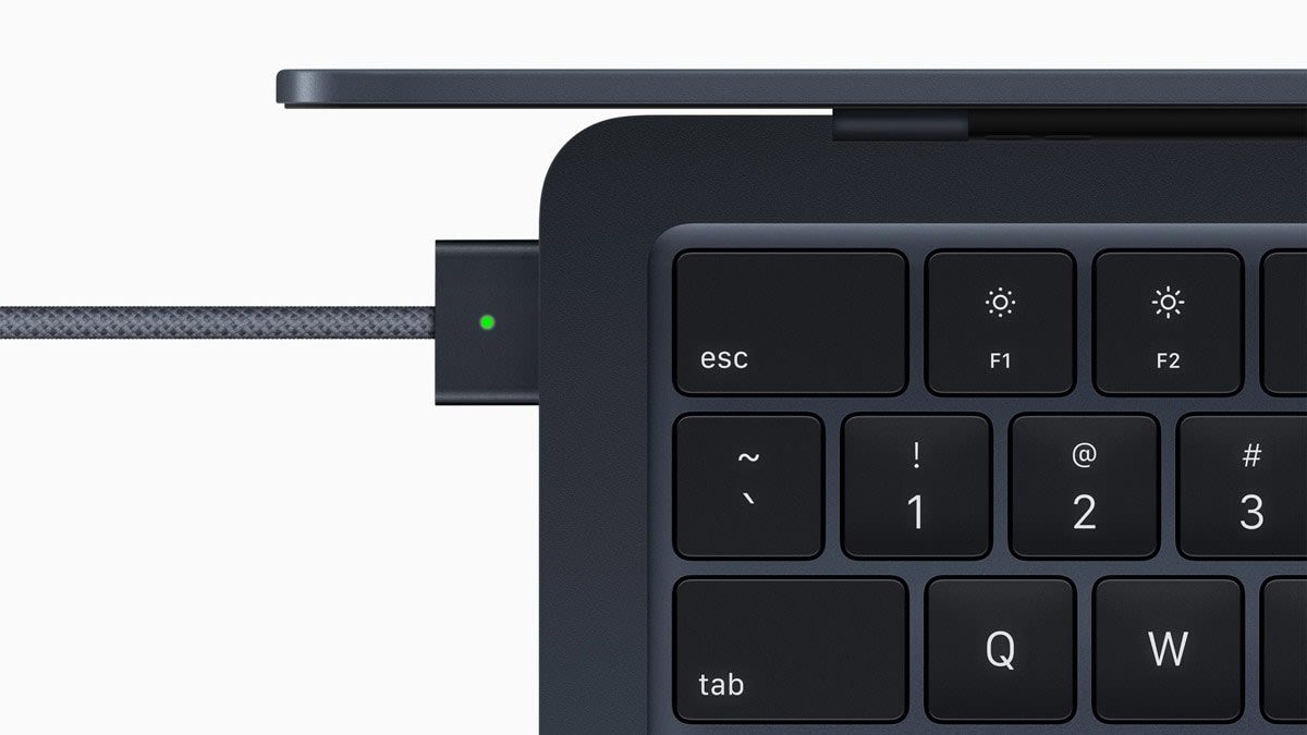 an Apple MacBook-Air with a magsafe power adapter plugged in