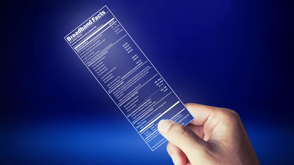 Hand holding new broadband label