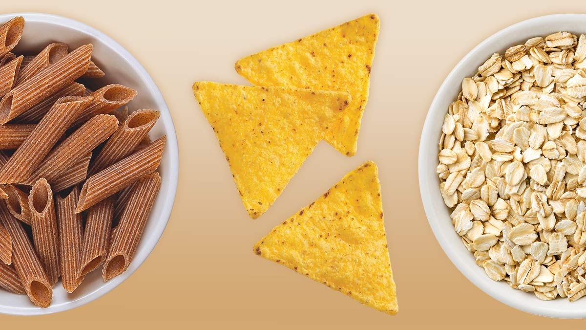 whole wheat penne pasta in white bowl, 3 corn tortilla chips, and raw oatmeal in white bowl
