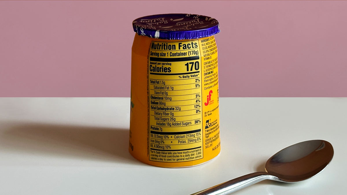 the back of a strawberry yogurt container showing the nutrition facts