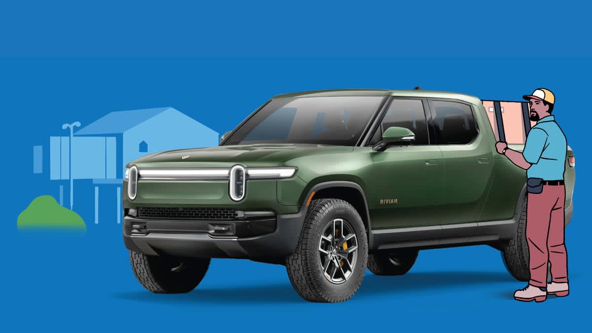 man standing at back of green Rivian R1T pickup truck