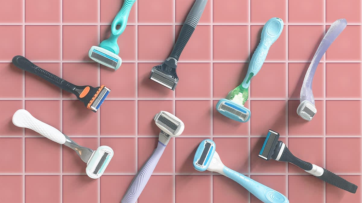 Nine razors on pink tile