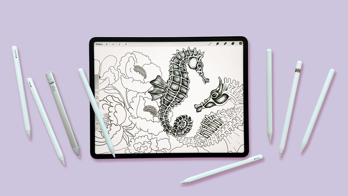 overhead view of tablet showing drawing of flowers and sea horses with 8 different styluses next to the tablet