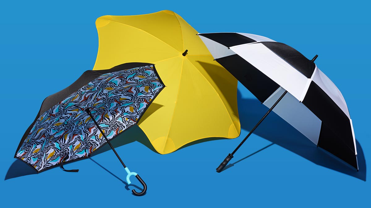 Shed Rain Reverse closing stick umbrella, Blunt Exec umbrella and GustBuster The Pro Series Gold umbrella